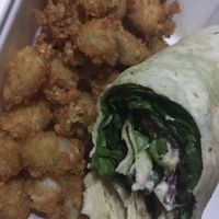 Eating in a dark car. Delicious wrap and tots! at Pig Minds Brewing in Machesney Park