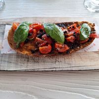 Sourdough crostini with cherry tomatoes and balsamic pearls at Sienna's in Dublin