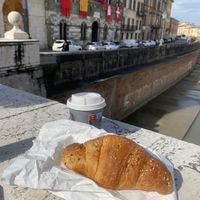 Croissant with orange jam  at House Cafe in Pisa