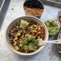 Quinoa avocado salad and beans and rice on the side    at The Grey Eagle Taqueria in Hot Springs