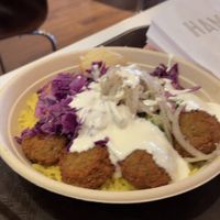 Falafel with salad, onions, and pickles. Topped with tahini.   at Naf Naf Grill in Naperville
