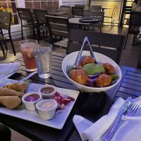 Pictured: Vegan Wings and Buffalo Cauliflower salad  at The Purple Elephant in Northport