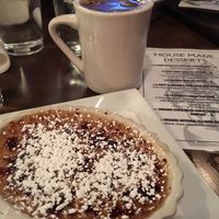 Coconut custard brûlée dessert with coffee and almond milk at The Purple Elephant in Northport