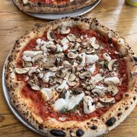 We got the vegan lamb pizza and a vegan margherita with mushrooms  at Pizzarova in Bristol