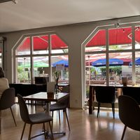 Other indoor tables looking out to the riverside tables  at Gecco Café & Concept Store in Buehl