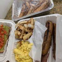 Vegan breakfast- "The Slam"- includes sausage, bacon, scrambled eggs, hash browns, avocado toast, and French toast with maple syrup at The Supreme Dessert Shop in Willingboro