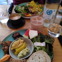 Breakfast with different home-made spreads, grilled tempeh, pulled jackfruit, salad and melon slices at schnack in Mainz