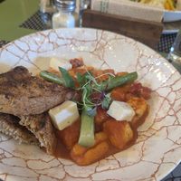 Vegan gnocchi with tofu and red sauce. at El Jardin Healthy Food And Coffee in Cusco