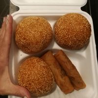 Sesame balls to go. Got the spring rolls for free. Thank you! at ChuMinh Tofu and Veggie Deli in Seattle