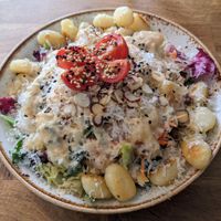 Fried gnocchi with sage and garlic and salad at Deli Kitchen in Munich