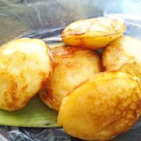 In front of the shop they're making some sweets 😍 at Kaun Im Yok Vegan Restaurant - H&H in Vang Vieng