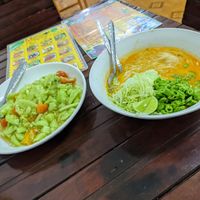 Cucumber salad and coconut noodle soup at Kaun Im Yok Vegan Restaurant - H&H in Vang Vieng