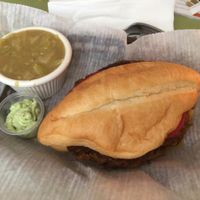 $10 special: dragon burger on a roll, side of spicy cabbage soup, vegan cilantro sauce, and iced teas at Mother Earth Sanctuary Cafe in Lake Worth