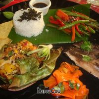 custom vegan plate:  pineapple tempeh in banana leaf, jerk portobello mushrooms, pickled carrots, veggies, wontons and rice at Kaya Island Eats in Key West