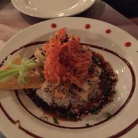 fried sesame tofu with sticky rice in a spicy sauce with ginger carrot topping, just yummy! at Kaya Island Eats in Key West