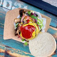 Burger with mushrooms and salad. Sauces added.  at Vegazmo in Tynemouth