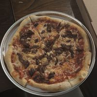 Caramelized onions, olives, and garlic vegan pizza   at Sky High Pie in Joshua Tree