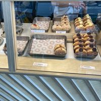 Vegan doughnuts in the back row on the left and in the middle  at Small Goods in Bristol