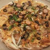 Pizza with various toppings at Marruzella - Los Arcos in Sevilla