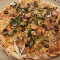 Pizza with various toppings at Marruzella - Los Arcos in Sevilla