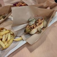 Green vegetable sausage with pickles and onion at IKEA in Lhospitalet De Llobregat