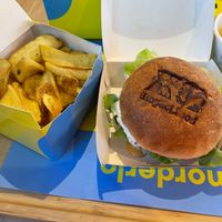 Cheesy Cheddar Explosion Burger with fries at Impact Food in Rome