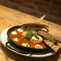 Shakshuka. Poached eggs in tomato, peppers, courgette onion goats cheese etc. 5 stars at GiGi von tapas in Barcelona