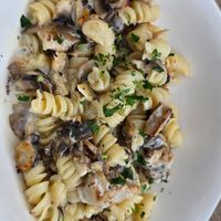 Vegan creamy mushroom pasta with vegan chicken at Vapiano in Manchester