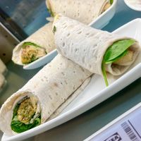Vegetable roll: roll with plant based sausage, hummus, pickle, fried onion and mustard at IKEA in Oviedo