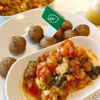 Plant based protein "meatballs", tomato and spinach ragout, quinoa and vegetables at IKEA in Oviedo