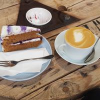 Vegan cake and flat white at Shop from Crisis in North London