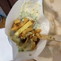 Half-eaten fried  at Maoz - Leidsestraat in Amsterdam