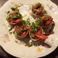 Steamed manto dumplings filled with soy mince and onion. Served with almond and garlic yogurt, chana dal and fried garlic at Manto in Malmo