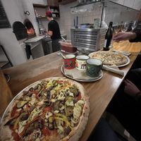 Sitzplätze am Pizzaofen  at Cuatro Gatos in Bamberg