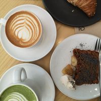 Vegan banana bread and vegan croissant. Oat matcha latte and oat flat white at Numa Café - AMUN Cafe in Lisbon