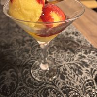 Mango sorbet with raspberry coulis  at El Temple in Benidoleig