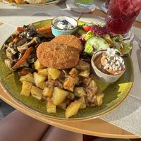 Chickpea fritters/ potatoes/vegetables . Drinks were berry iced tea and mint lemonade   at Alubia plant power in Mallorca