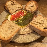 Hummus to share. The cilantro salsa on top is to die for  at Honest Greens - Fuencarral in Madrid