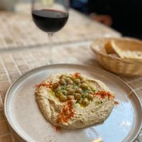 Traditional hummus with organic red wine   at Maison Binder in Paris