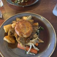 Vegan turkey and stuffing roast with a Yorkshire pudding, roast potatoes and veg, plenty of gravy and all super tasty. at The Commodore Inn in Grange-over-sands