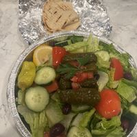 Huge (size small) Greek salad with dolmades and pitas.  at The Great Greek Mediterranean Grill in Mount Pleasant