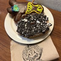Vegan Voodoo raspberry filled. And Dirt doughnut with Oreo topping. DELICIOUS   at Voodoo Doughnuts in San Antonio