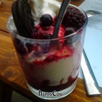 vanilla ice cream with soft fruits, cream and cookie at Wind und Wetter in Berlin