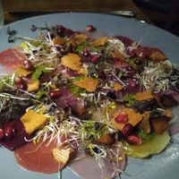 Multi coloured beet carpaccio with homemade tofu bacon at Linde Restaurant in Heidelberg