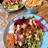Vegan chicken salad bowls plus regular fries    at Biblos in Bristol