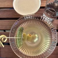 dirty vodka martini with large queen olives and a cornichon   at Poco Fiasco  in Dallas