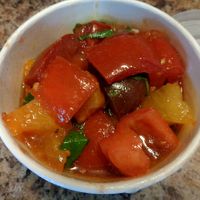 Heirloom Tomato Salad. Locally-grown heirloom tomatoes, basil, red onion slivers, balsamic.  at Rabbit Food in Painesville