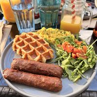 The Great Vegan Breakfast with Mango tropical juice and side of potatoes  at Craffles in Vancouver