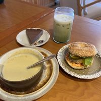 Soupe du moment (soup of the day, which was a “grilled corn”), Bagelwich au végé-pâté (veggie patty bagel sandwich), Café glacé ou matcha glacé, chocolate pie  at Le Sasquatch in Sainte-anne-des-monts