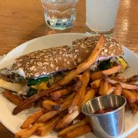 Oyster mushrooms cheesesteak sandwich and fries. Top of the tops for brunch! at Sweet Grass Grill in Tarrytown